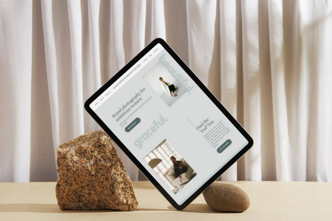 Aesthetic mockup of a tablet displaying a feminine website